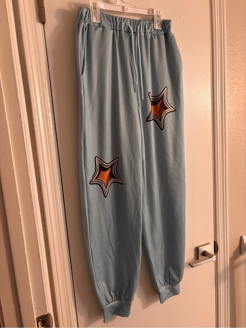 Unk Light Blue Track Pants with Anime Orange Star Patches